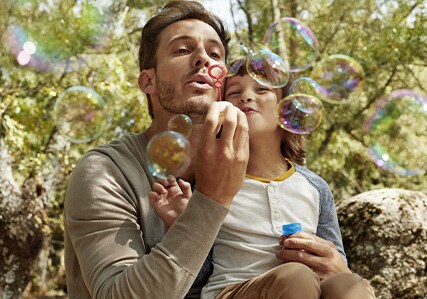 Father and son Blowing bubbles 